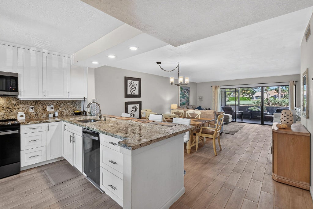Photo of 12926 BRIARLAKE Drive #104b, Palm Beach Gardens, FL 33418 (MLS # B26086049)