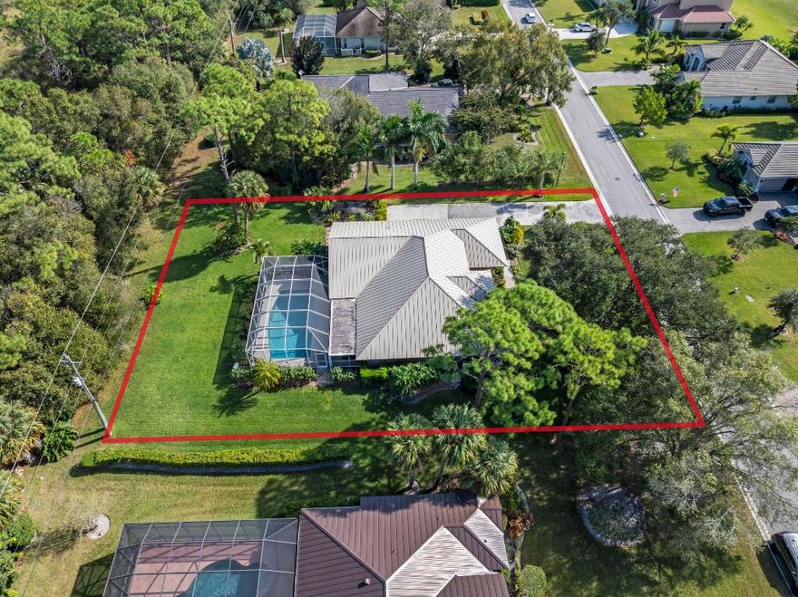 Beautifully maintained 3 bed, 2.5 bath pool home is tucked away in one of St Lucie's best kept golf course community secrets, Meadowood. Set on nearly half an acre, the home features high ceilings, split floor plan, oversized screened lanai, and a heated pool offering quiet privacy away from the course. Enjoy living, dining, family room, and breakfast nook spaces with four sliders opening to the pool area. Updates include 2024 tile, 2023 water heater, all new 2025 appliances, and a 2021 metal roof. Oversized 2 car garage. No mandatory membership required, though available. HOA includes cable & water with no application fee or deposit. Pet friendly, gated and guarded community with championship golf, tennis, fitness, and social amenities. Priced to sell and located just south of Vero