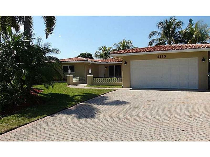 Great price for waterfront home on a quiet cul-de-sac.  Totally remodeled 3 bedrooms, 2 baths house with a pool. 70ft waterfront home. with boat lift to handle 20ft - 25ft boat. Totally renovated home, impact windows, doors and garage door, bamboo wood fl oors, new kitchen with wood cabinets, granite, stainless appliances, all new baths, inside laundry room, 2 car garage. Near Wilton Manors downtown, beach, Las Olas & Galleria.