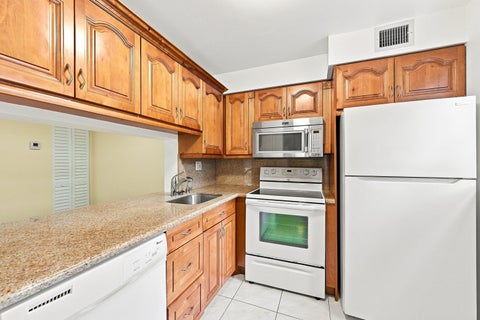 Tiny photo for 2753 S OAKLAND FOREST Drive #102, Oakland Park, FL 33309 (MLS # B26059187)