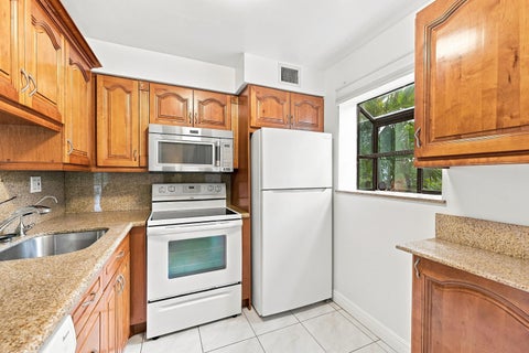 Tiny photo for 2753 S OAKLAND FOREST Drive #102, Oakland Park, FL 33309 (MLS # B26059187)