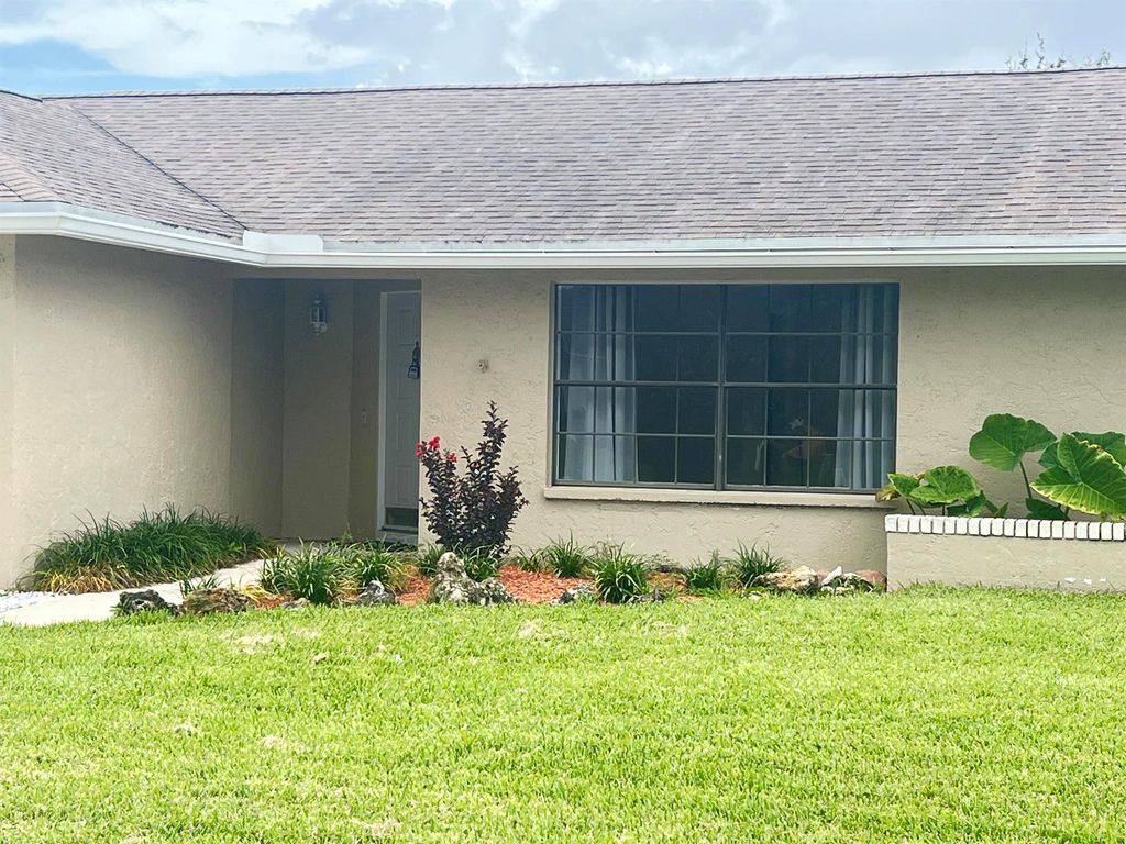 Photo of 174 Parkwood Drive, Royal Palm Beach, FL 33411 (MLS # R11094090)