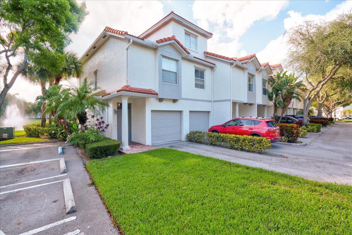 RARE LAKEFRONT CORNER UNIT - Seldom available 3-story townhouse in an award-winning gated East Delray just minutes from Atlantic Ave & 4 stoplights to beach. Unobstructed lake views from the living room and primary suite capture sunrise and moonrise daily. Modern appliances + brand-new AC (Aug 2025). Community has new roofs, resurfaced roads, lush landscaping, strong reserves, low HOA, no special assessments. Very short walk to resort-style pool, fitness center, clubhouse, tennis/pickleball, basketball, volleyball, walking/bike paths, playground, picnic gazebos, and resident car wash. Includes garage, driveway, guest parking. Pet-friendly with no rental restrictions--ideal for homeowners or investors. Walk to Whole Foods, Trader Joe's, Publix, dining, and salons; bike to Beach in minutes!