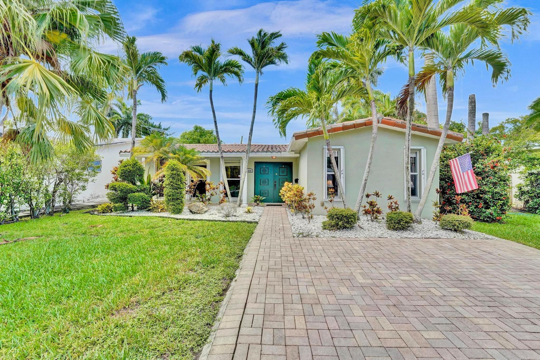This warm and welcoming 3 bedroom + bonus room, 2 bath Hollywood Lakes home will make you smile as soon as you walk through the door. It has plenty of natural light, with a very open floor plan, and spacious bedrooms. There is a long paver driveway in the front for plenty of parking, and the beautiful backyard has a patio with plenty of room for a pool. Key features include 2024 AC, 2023 tankless water heater, accordion shutters and updated electrical. As much as you will love the house, you will love the location even more being only 1.5 miles to Hollywood Beach! Situated in between North Lake and the Hollywood Beach Golf Club, you are also a mile to Downtown Hollywood and the Arts Park. Buying this beautiful house is as easy as 1-2-3-4!