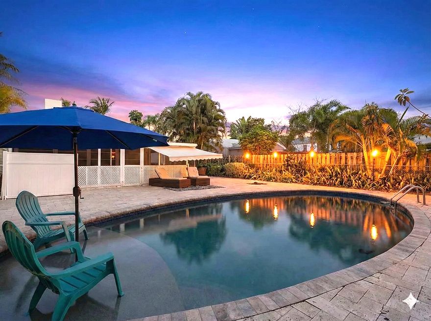 Experience the best of the Lake Worth Beach lifestyle at 411 S Palmway. Located in a highly desirable historic neighborhood, this charming 3-bedroom, 2-bathroom residence offers a private coastal sanctuary just steps from the Intracoastal Waterway. The true highlight of this property is the incredible outdoor living space, perfectly designed for entertaining. Step into your backyard oasis where a sparkling private pool with Baja shelf takes center stage, surrounded by lush, mature landscaping that ensures complete privacy. The expansive patio area provides the ideal setting for al fresco dining, weekend BBQs, or simply relaxing in the Florida sun. Inside, the home spans 1,750 square feet of inviting living space, featuring a comfortable layout that flows effortlessly to the outdoors. The kitchen boasts stainless steel appliances, quartz countertops, and a gas stove. Storage is plentiful with a pantry and multiple closets; both guest bedrooms feature walk-in closets. You will find the rejuvenated original hardwood in most of the living space and in the bedrooms. With this home, you are perfectly positioned to enjoy the area's top amenities. You are just a short stroll from Bryant Park, famous for its boat ramp, amphitheater, and scenic waterfront walking paths. For the avid golfer, the Lake Worth Beach Golf Club is just minutes away--a quick drive or scenic bike ride along the water brings you right to the first tee of this classic course with stunning Intracoastal views. With downtown Lake Avenue's eclectic dining and the pristine beach just over the bridge, this home offers an unbeatable location. Don't miss your chance to own a piece of paradise in Lake Worth Beach!