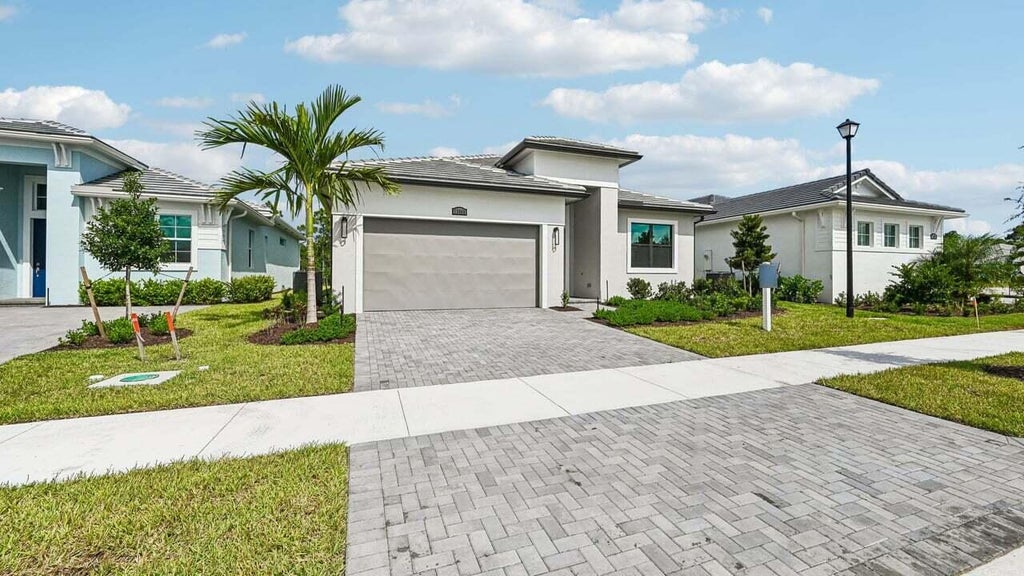 Photo of 13566 SE Grovewood Drive, Port Saint Lucie, FL 34984 (MLS # B26065625)