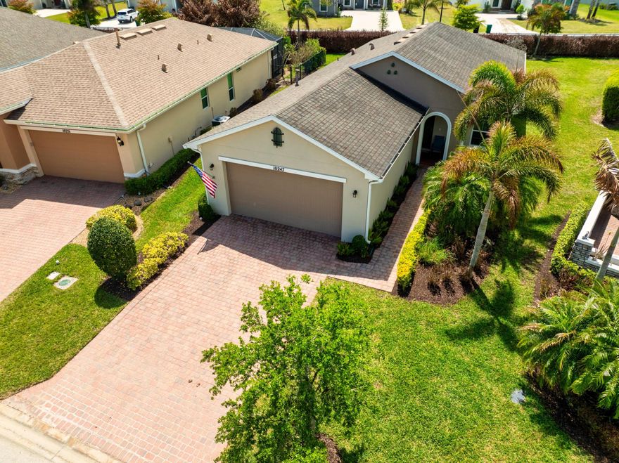 Welcome to beautiful Vitalia-Premier 55+Gated Resort community in Tradition. This 2-bedroom, 2-bath home features a versatile den, open-concept layout, complete impact glass, spacious kitchen, extended garage, tile floors throughout plus extra large backyard to create your own outdoor living spaces The oversized primary suite is a true retreat, featuring a huge walk-in closet, dual vanities, and a large walk-in shower. A flexible den with doors provides the ideal space for a home office, guest room, or hobby area. Your New Lifestyle includes Amazing Amenities-resort style pool, pickleball/tennis courts, putting greens, fitness center, cards/games, clubs and events.
