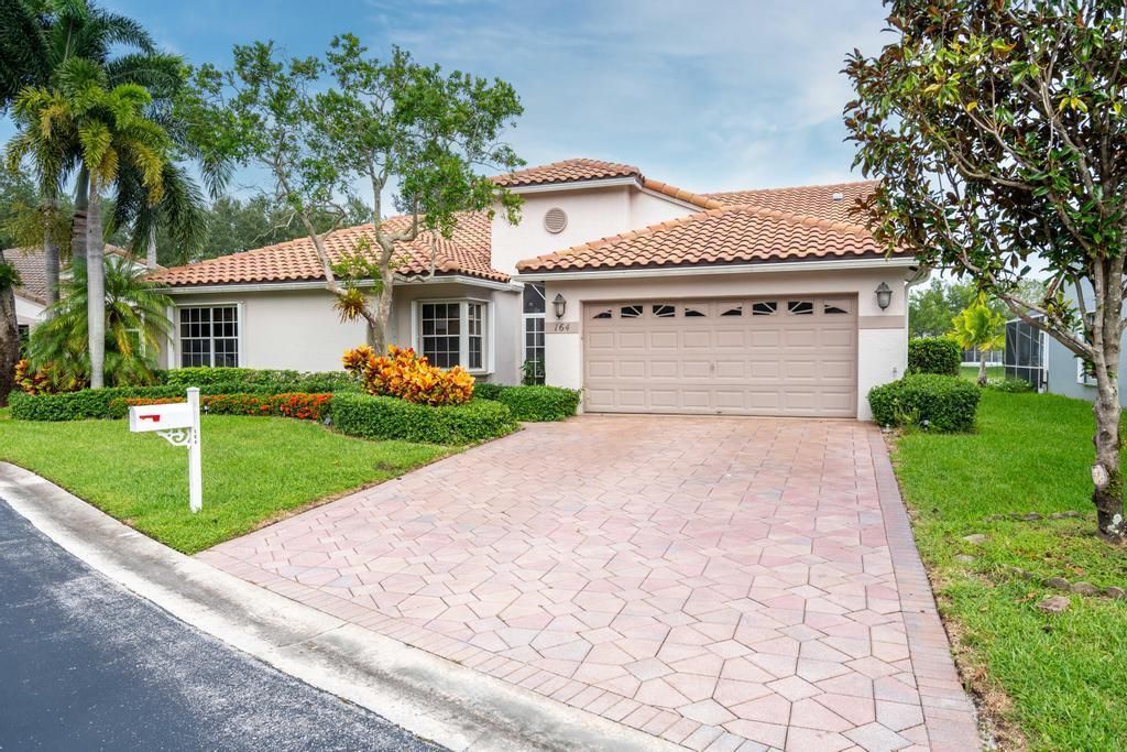 Photo of 164 Egret Circle, Greenacres, FL 33413 (MLS # R10927165)