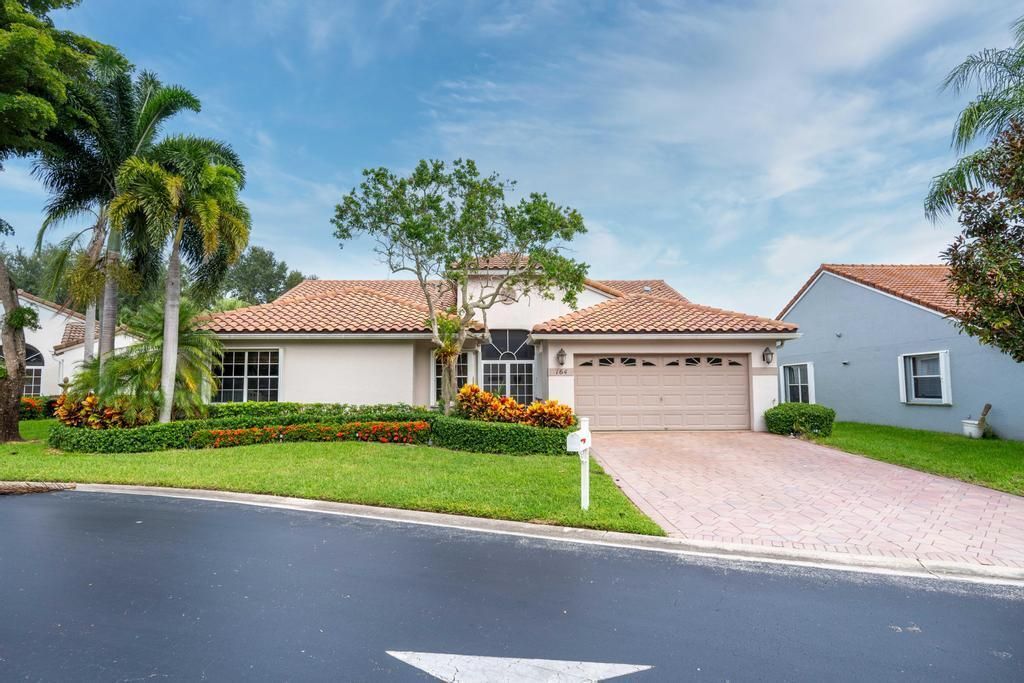 Photo of 164 Egret Circle, Greenacres, FL 33413 (MLS # R10927165)