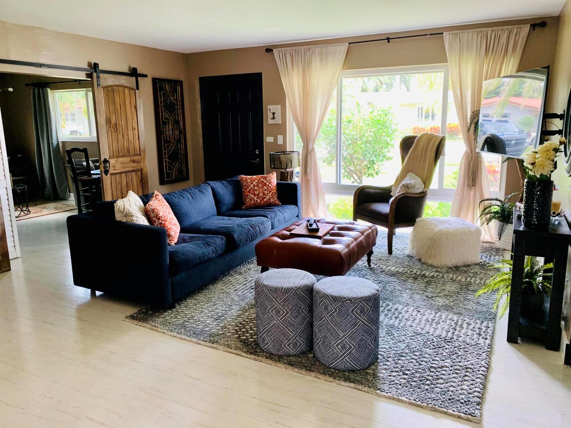 MUST SEE! Easy to show! Corner lot with mature landscaping for a tropical Florida retreat. Ideal location east of US1 is close to the beach and everything South Florida has to offer. Home features 2 bedrooms with an enclosed den, and two full baths. Offered fully furnished and turn key for a seasonal rental. Or partially furnished for annual rental. Lot also had gate for outdoor storage for a boat or RV. Easy to show and available immediately. Please note: Pictures taken prior to last tenant, some decor has been removed.Annual $3750/mo - Tenant pays utilities/internet - Landlord pays - Lawn/Water/TrashSeasonal $5500/mo - Includes utilities, internet, lawn, pest control, water, trash