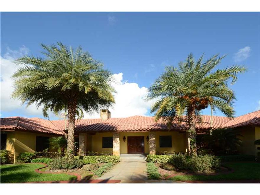 IMPRESSIVE DAVIE ESTATE THAT OFFERS 8400+SF LIVING AREA! SITUATED ON APPROX 5 ACRES, IT OFFERS 5 BEDROOMS, 2 MASTER BATH SUITES, & A GUEST HOUSE OFF OF COURTYARD ENTRY.GRANITE & MARBLE FLOORS THROUT MAIN LIVING AREA.CUSTOM GOURMET KITCHEN W/LARGE ISLAND &  BREAKFAST AREA! FABULOUS FAMILY ROOM W/EXPOSED WOOD BEAM CEILINGS, CUSTOM WETBAR W/SEATING & ENTERTAINMENT CENTER!FORMAL ENTRY W/LARGE FOYER & HALLWAYS THROUT. ENSUITE GUESTBEDROOMS. FORMAL LIBRARY W/CUSTOM CABINETRY!POOL & BASKETBALL COURT/ GATED ENTRY!