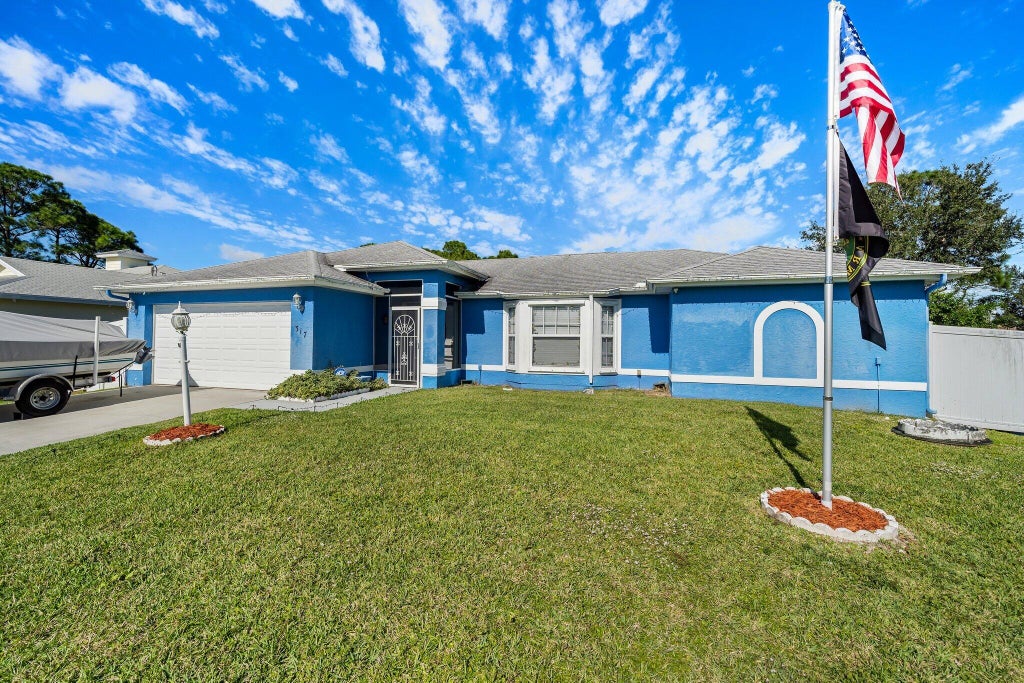 Photo of 317 SW Duxbury Avenue, Port Saint Lucie, FL 34983 (MLS # R10766078)