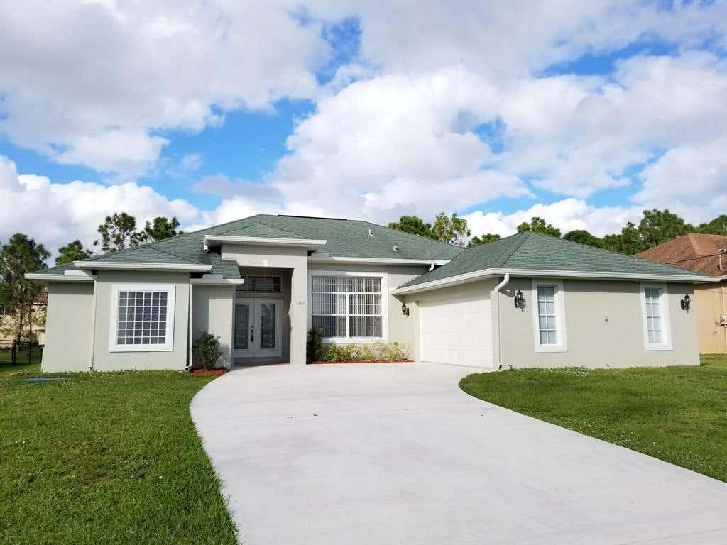 Photo of 1961 SW Fears Avenue, Port Saint Lucie, FL 34953 (MLS # R10763775)