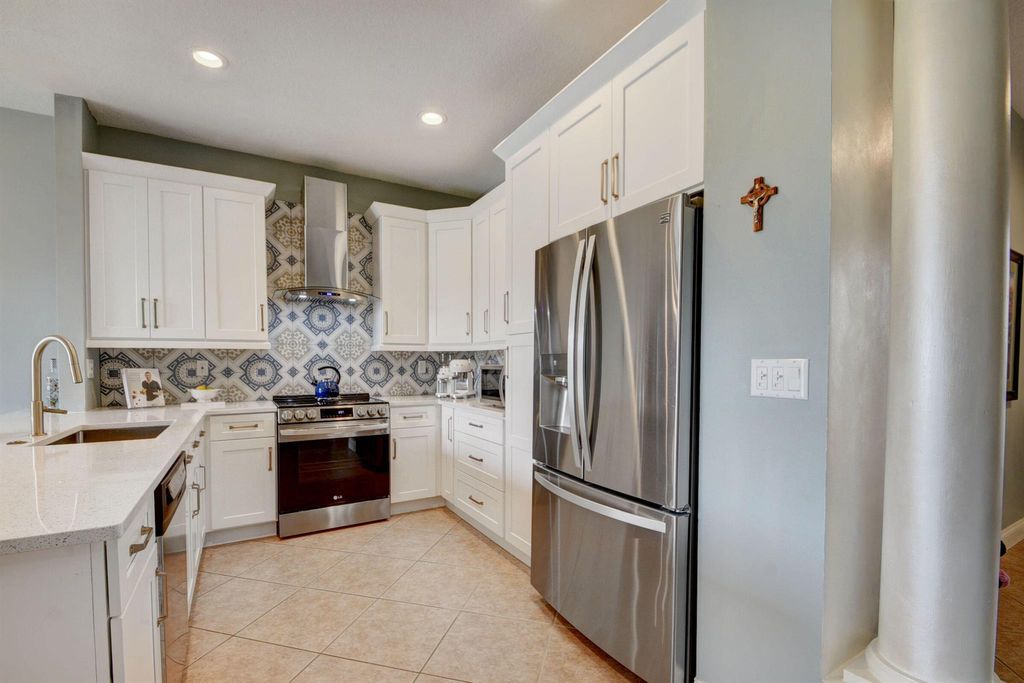 Photo of 6147 Seminole Gardens Circle, Riviera Beach, FL 33418 (MLS # R10938581)