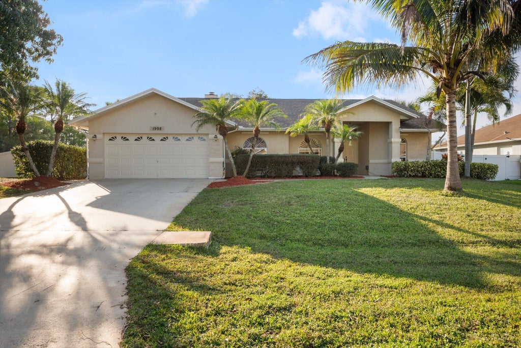 Photo of 1998 SW Davis Street, Port Saint Lucie, FL 34953 (MLS # R11061442)