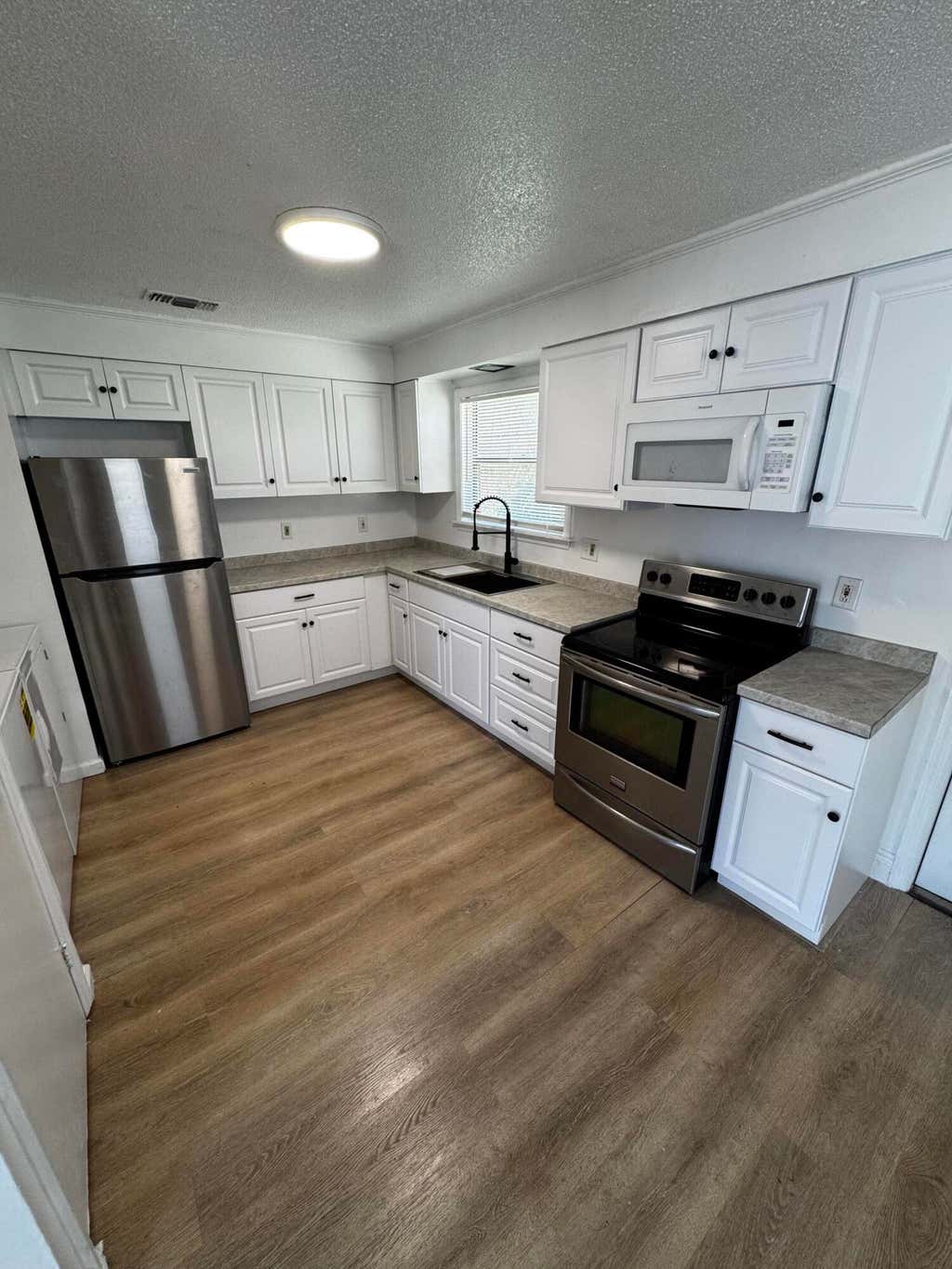 Photo of 1464 W 32nd Street, Riviera Beach, FL 33404 (MLS # B26046916)