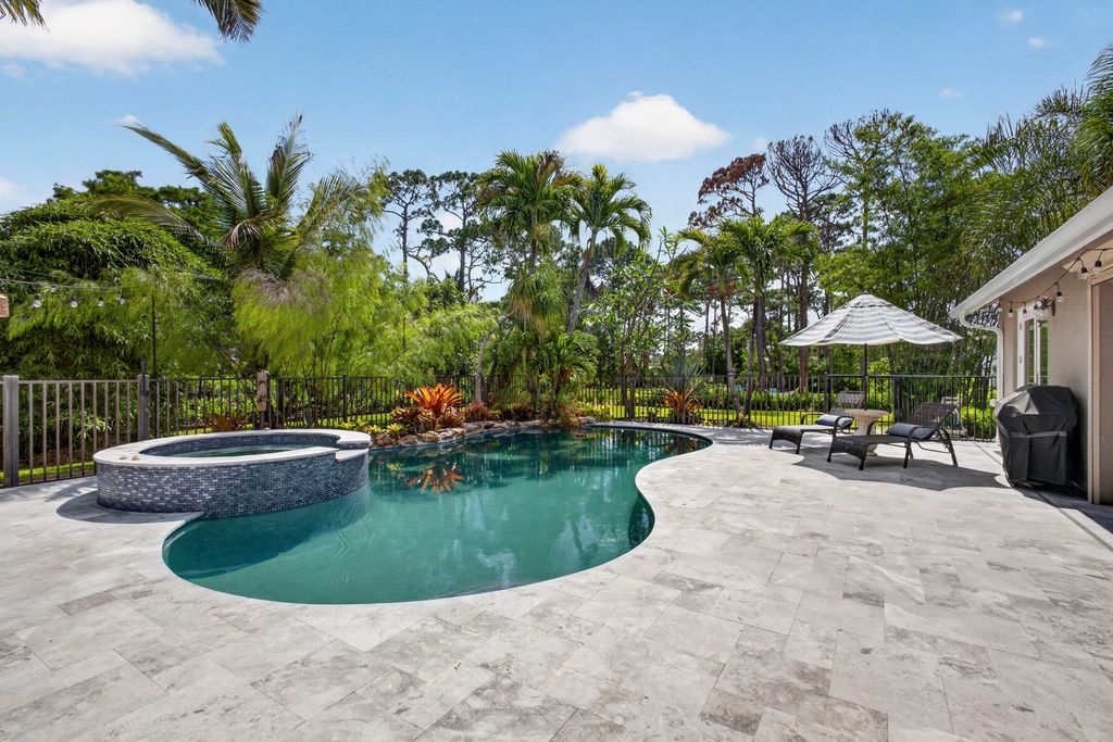 Photo of 12632 Citrus Grove Boulevard, West Palm Beach, FL 33412 (MLS # B26020401)