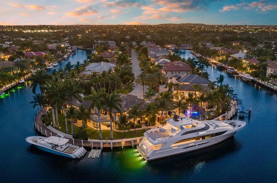 Introducing Aqua Del Mar, an expansive double point gated estate located in Lighthouse Point. This remarkable property boasts an incredibly rare 400 feet of deep water frontage with ocean access, with panoramic views of the waterway. Enveloped by the tranquil ambiance of swaying palm trees and natural surroundings, Aqua Del Mar is an ideal getaway for aficionados of Florida's luxury lifestyle, as well as yachting and car enthusiasts. The estate comprises of a primary residence and a separate guest house, encompassing 8 bedrooms, 7 full bathrooms, 3 half bathrooms, and an impressive 8,800 SF of living space (with over 10,100 SF overall).