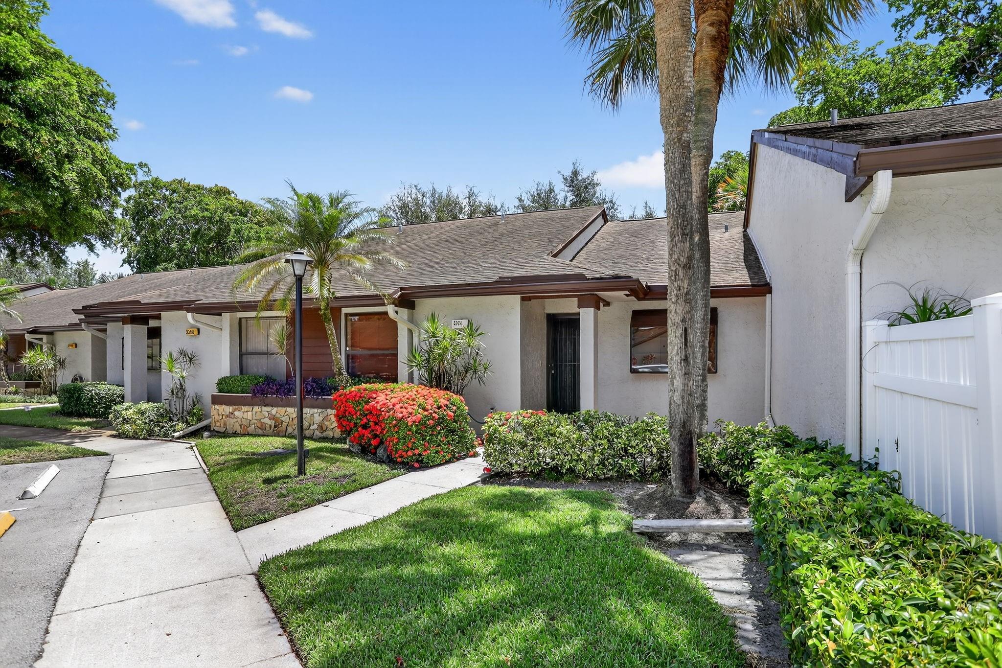 Step into this beautifully maintained 2-bedroom, 2-bathroom villa that combines comfort, style, and serenity. From the moment you enter, you'll notice the elegant diagonal tile flooring that adds a touch of sophistication to the space. The split floor plan offers maximum privacy, with spacious bedrooms on opposite sides, ideal for hosting guests. The true highlight of this home is the enclosed Florida room, offering peaceful views of the lake. Whether enjoying your morning coffee or unwinding with a glass of wine, this serene space surrounded by lush greenery and natural light quickly becomes your favorite spot. This fee simple villa blends tranquility with convenience, located just minutes from shopping centers, dining, and everything Coconut Creek has to offer.