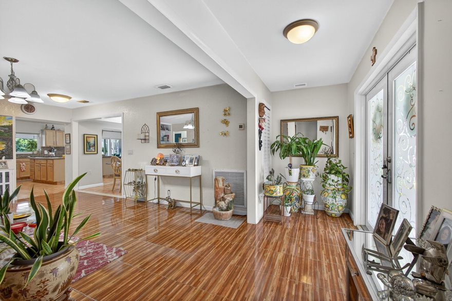 Welcome to this beautifully maintained home in the sought-after community of Lake Clarke Shores. Featuring a natural gas connection, full-house Generac generator, brand-new LG fridge (2025), remodeled master bath (2017), and updated kitchen/family room with impact windows and sliders (2006). Other highlights include a 5-ton A/C with new ducts (2025), tankless gas water heater (2021), roof (2006), saltwater softener, resurfaced fiberglass pool (2023), and a 32x10 screened patio. The layout offers a private in-law suite option, laundry room, 2-car garage, and no popcorn ceilings. Lake Clarke Shores provides residents with a police department, recreation center, boat ramp access, and no HOA. Welcome to this spacious and well-maintained residence located in the highly desirable community of Lake Clarke Shores. This home is filled with modern upgrades, functional features, and thoughtful design elements that make it truly unique.
The home offers a natural gas connection from the city, powering a gas stove, tankless gas water heater (2021), dryer, and a full-house Generac backup generator that runs the entire property in the event of a power outage. The kitchen features a brand new LG refrigerator (2025), wall oven with built-in microwave, and a beautifully designed layout with granite countertops that flows into the family room, both added in 2006. The family room and kitchen boast impact windows and sliding doors that open to the outdoor living space which overlooks the pool.
Inside, the residence includes a separate laundry room with full-size washer and dryer, a double-door tiled entry, and a two-car garage with updated electrical panel, exit door, and windows. The home is completely tiled throughout with no popcorn ceilings, providing a clean and timeless look.
The master suite offers a bay window facing the front of the home, a spacious walk-in closet with window, and a remodeled master bathroom (2017) featuring a jacuzzi tub, sunken walk-in shower, double sinks, and a linen closet. A guest bedroom can be used as a private suite or in-law quarters, complete with a half bath that includes an updated vanity and toilet. The guest bathroom, remodeled about 5 years ago, features a wider shower and entry designed to accommodate wheelchair access.
Additional features include:
" New A/C ducts (2025), 5-ton system
" Roof (2006) Concrete tile rated for 35-50 years
" Impact windows in kitchen and family room; all other windows replaced to Miami-Dade code with shutters
" Bedrooms with original wall A/C units (still functional)
" Living room with built-in cabinets
" Saltwater softener for the entire home (City Water)
" Sprinkler system on well with timer
" Pool (1999, fiberglass, resurfaced ~2 years ago)
" Screened patio (32x10), added 10-15 years ago with screens replaced 2018-2019
" Outdoor pergola for plants or entertaining
The community of Lake Clarke Shores is one of the area's most sought-after neighborhoods, offering its own police department, a recreation center with basketball, paddleball, and tennis courts, and a private boat ramp with resident access to Lake Clarkeall with no HOA restrictions.