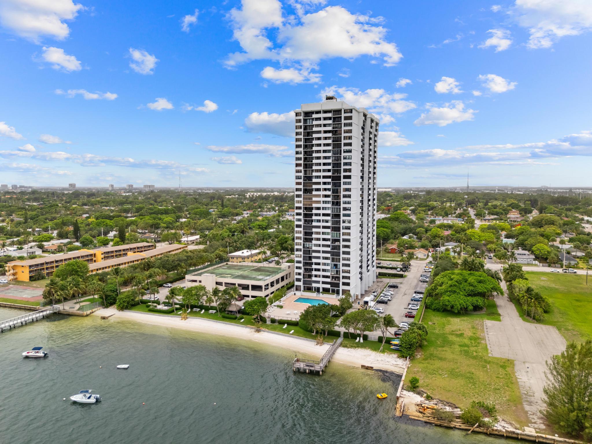 Beautifully updated with laminate flooring throughout, this residence features a modern kitchen and renovated bathrooms. Enjoy resort-style living with exceptional amenities including a 24-hour manned gate, 24/7 concierge front desk, and a heated saltwater pool overlooking the Intracoastal. Relax on the private beach, take advantage of the day dock, or unwind at the tiki hut and BBQ areas. Additional perks include a fitness center, library, car wash station, and a personal storage locker. Monthly HOA covers cable, internet, and water. Prime location just minutes from shopping, dining, downtown, Palm Beach International Airport, and more!
