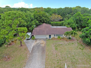 Huge Lot!! Home Getting Painted Inside & Out By 6/16. Existing House Has Great Open/Split Floor plan, Home Has Been Updated Since It Was Built, Located on 200 x 160 Ft Lot, 3 BD / 2 BA Plus Office Area w/2 Car Garage, Lanai w/Screened Patio, Low County Taxes, Bring Your Boat & RV!! Street Has Deeded Access To Intracoastal To Watch Boats Go By.