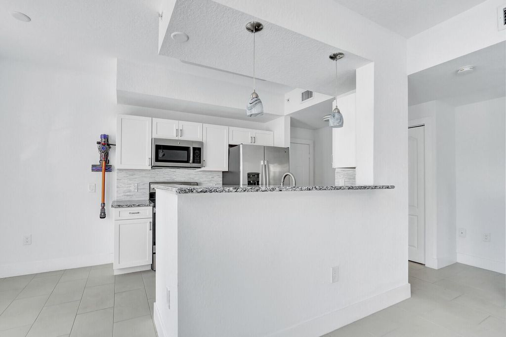 Photo of 11032 Legacy Drive #102, Palm Beach Gardens, FL 33410 (MLS # R11093994)