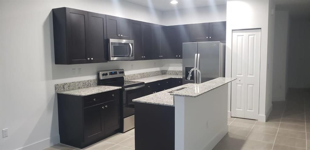 Photo of 2018 Oysterwood Lane, Riviera Beach, FL 33410 (MLS # R10713838)