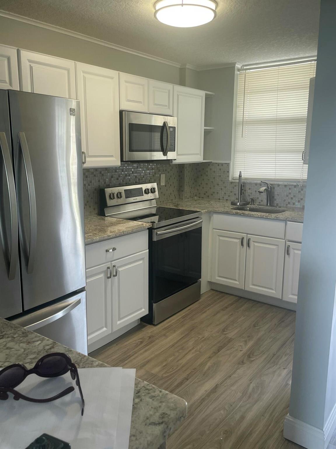 This beautifully updated 1-bedroom, 1-bathroom condo is a perfect retreat. Relax on your balcony while watching boats pass by on the Earman River and Intracoastal Waterway, visible from your living room, bedroom, and balcony. The community offers amenities, including a clubhouse with a fitness room, billiard room, and community room. You'll also find a convenient kayak rack for water enthusiasts and a refreshing pool with inviting views of the ICW. This charming condo is available fully furnished, allowing you to move in comfortably and easily.
