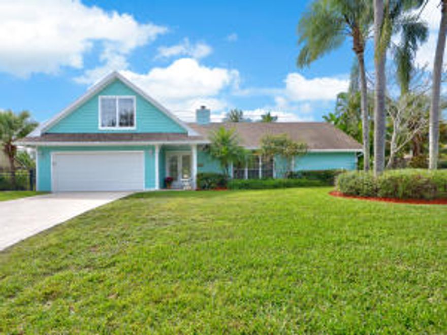 Charming Key West Style 4 bedroom/3 bath/pool home is located in the highly sought after community ''Tequesta Country Club'' which offers a voluntary HOA membership for the community private boat ramp with ocean access. Zoned for Jupiter A-Rated schools and close to the beach, Harbourside Place and fun local dining and shops. Boat parking beside home, Poolside Tiki Bar with open outdoor patio is perfect for  entertaining. Other features include: Fireplace, coastal white cabinetry with granite counters in kitchen, Hardy plank siding, Mexican tile and laminate wood flooring, loft area with open high ceiling to family and kitchen, plantation shutters, new attic fan and insulation, master and guest suite on first floor. Must see!