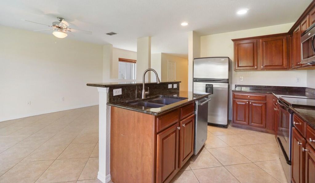 Photo of 2211 SW Rockport Road, Port Saint Lucie, FL 34953 (MLS # R10842641)