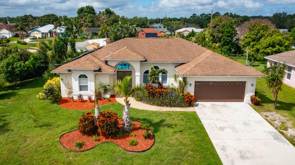 Photo of 3210 SE OTIS Lane, Port Saint Lucie, FL 34984 (MLS # B26081311)