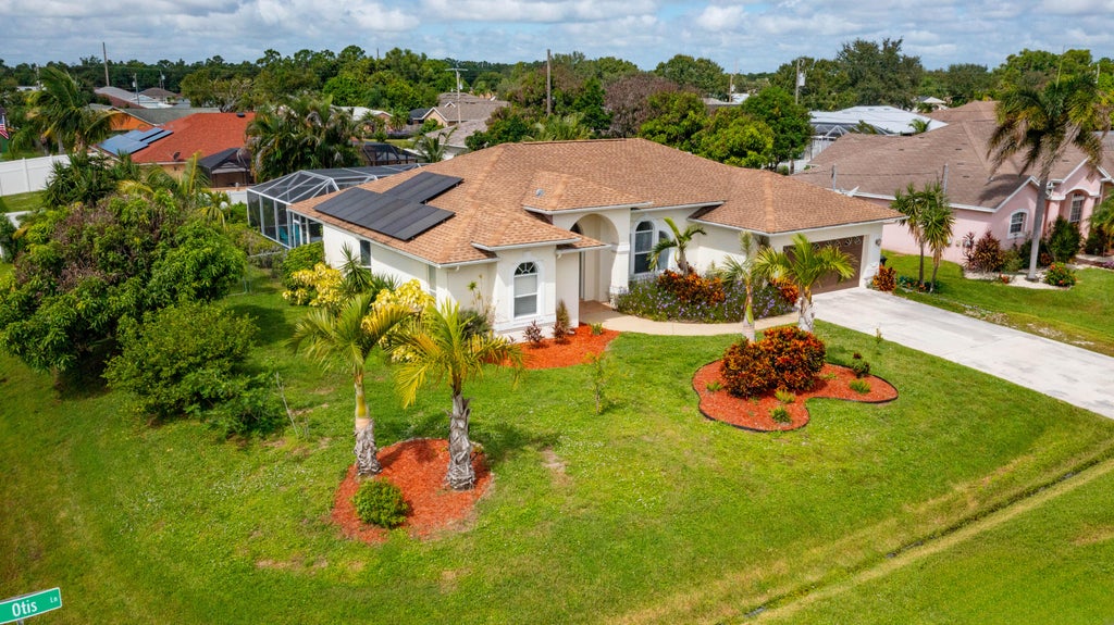 Photo of 3210 SE OTIS Lane, Port Saint Lucie, FL 34984 (MLS # B26081311)