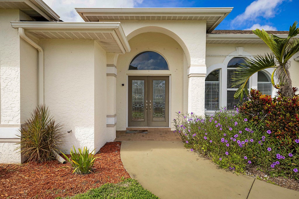 Photo of 3210 SE OTIS Lane, Port Saint Lucie, FL 34984 (MLS # B26081311)