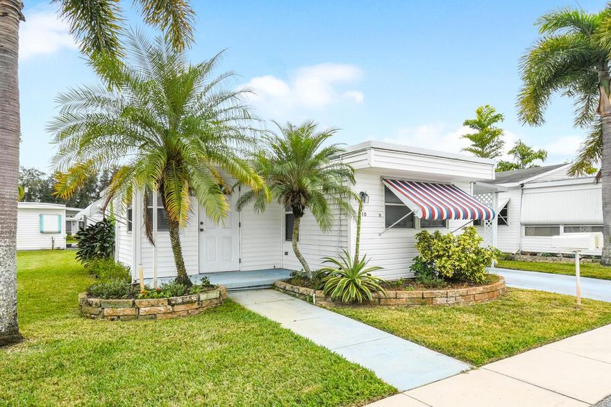 Spacious and well-maintained 2-bedroom, 1-bath mobile home in the highly sought-after Hidden Harbour 55+ community. This furnished home features an open floor plan with laminate and linoleum flooring throughout. Enjoy a large living room, dining area, and a functional kitchen layout. Enclosed carport adds privacy and usable space plus attached storage building with washer and dryer. Updates include new A/C (2017). Community amenities: Clubhouse with pool, shuffleboard, community room, marina access (fee/availability), and on-site management. Monthly fee includes: Basic cable, water, sewer, lawn care, trash, and use of recreational facilities. Buyer requirements: No rentals or pets allowed. Buyer must complete application ($50 fee), background check ($70 pp) and interview for approval.