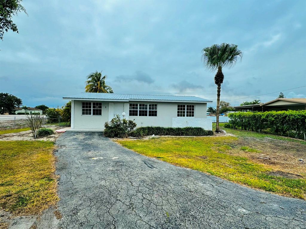 Photo of 1 NE I Avenue, Belle Glade, FL 33430 (MLS # R11053630)