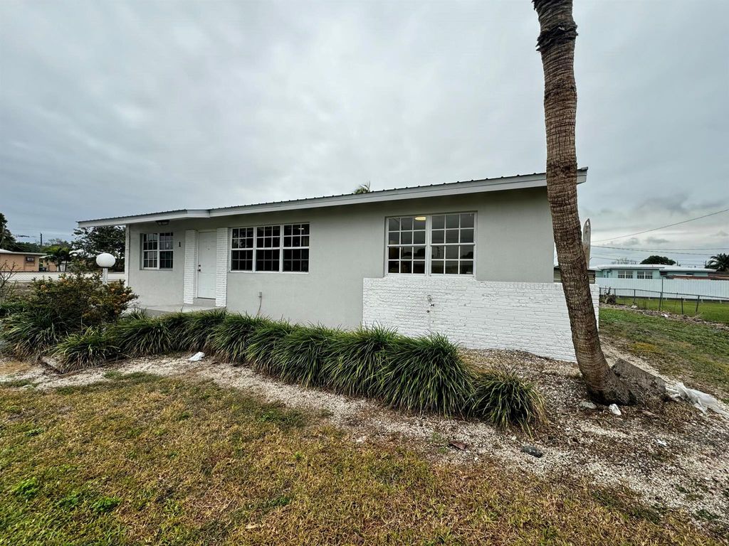 Photo of 1 NE I Avenue, Belle Glade, FL 33430 (MLS # R11053630)