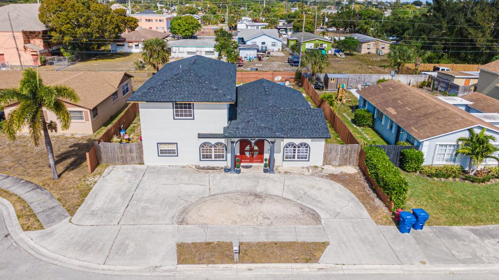 Photo of 1412 W 27th Street, Riviera Beach, FL 33404 (MLS # R11149799)