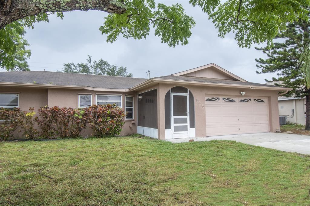 Photo of 119 SW Essex Drive, Port Saint Lucie, FL 34984 (MLS # R10796949)