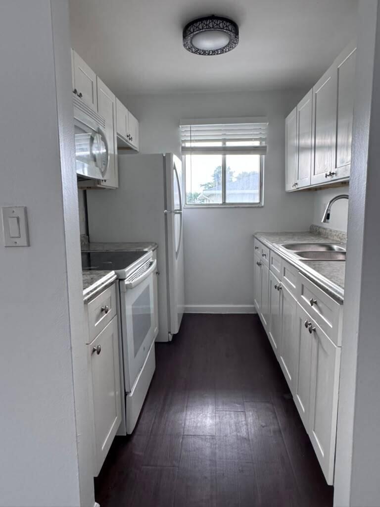 Photo of 113 E TIFFANY Drive #4, West Palm Beach, FL 33407 (MLS # B26082080)