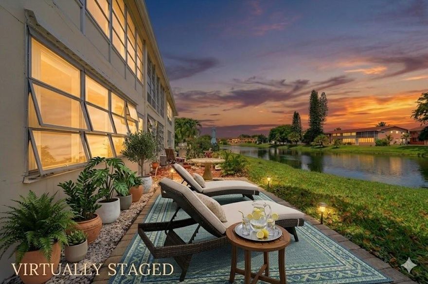 RARE WATERFRONT, END UNIT WITH CENTRAL AIR! Wake up to peaceful canal views just outside your home, where ducks swim by and sandhill cranes stroll along the water's edge. Tucked away in one of the most desirable spots, 165 Dorchester H is a rare end-unit on the water that brings in extra light and a level of privacy you just don't get in most units.  Inside, the space feels open and comfortable right away. Open the windows for a fantastic cross-breeze only end units get. The living areas and bedrooms are generously sized, with beautiful porcelain tile floors throughout the main living areas that give the home a clean, elevated feel without sacrificing ease. There's also a true dining area, so you're not squeezing a table into the living room. The kitchen and primary bathroom have both been thoughtfully updated, with a bright white kitchen that feels fresh and timeless, and a primary bath finished with elegant marble floors that add just the right touch of luxury. The primary bedroom features a walk-in closet. Both bedrooms feature sliding glass doors that open to an enclosed lanai (unique to Dorchester H), plus an outside brick patio, which ends up being one of your favorite spots in the home. It's perfect for morning coffee, BBQing, a quiet afternoon laying on a chaise lounge, or winding down at night while you take in the water and all the nature around you.  And here's what really makes this one stand out. It has central air, which is not common in Century Village and makes a noticeable difference in comfort. Add in the end-unit location and the water view, and you have a combination that is hard to come by and is going to go quick.  Living in Century Village is where this home really shines. This is a true social community where it's easy to meet people and stay as busy as you want to be. Nearby Dorchester is a resistance pool where you can stay in shape and stay cool. You'll find everything from pickleball and fitness classes to mahjong groups, book clubs, art classes, and card games happening all the time. At night, there are broadway style shows and concerts, plus a huge billiards room and social events that give you something to look forward to every week. Owners also benefit from their own private Dorchester pool. Residents also enjoy a beautiful clubhouse, indoor and outdoor pools, a fitness center, tennis, pickleball, cable, and transportation for grocery shopping and many of West Palm Beach's most popular spots, which makes day-to-day life simple and convenient.  If you've been waiting for something on the water that feels updated, spacious, and easy to live in, with a built-in social lifestyle, this one just makes sense.