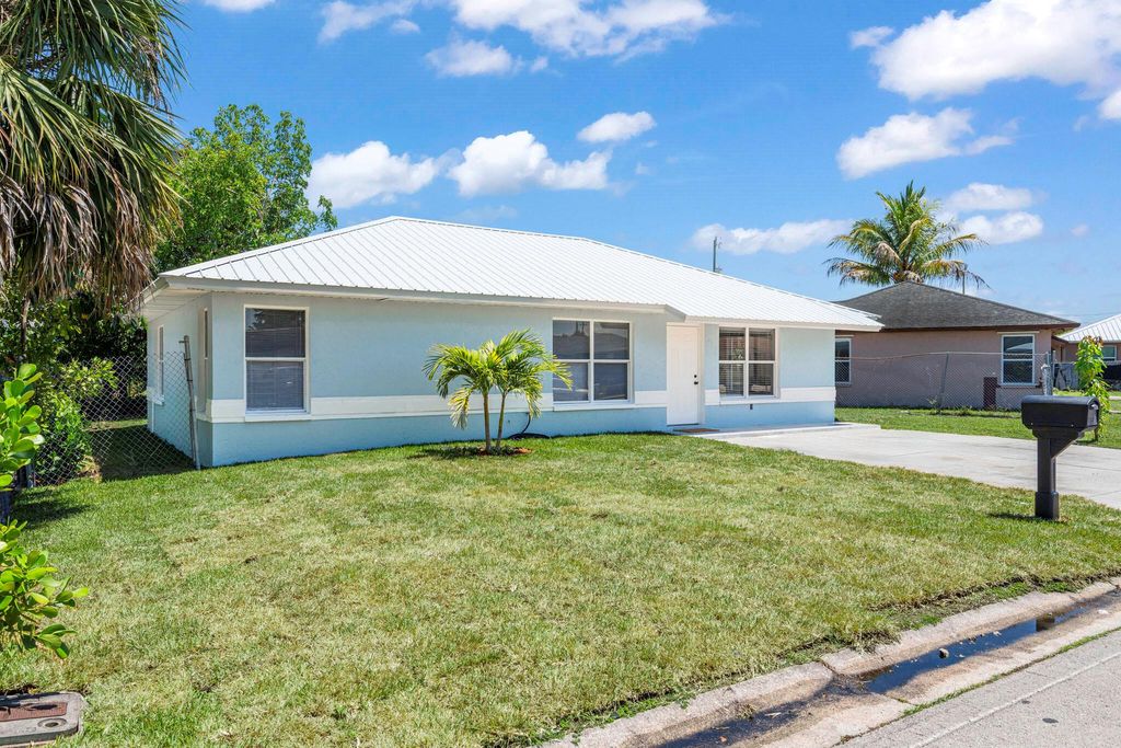 Photo of 561 SW 10th Street, Belle Glade, FL 33430 (MLS # R11091662)
