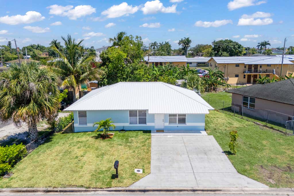 Photo of 561 SW 10th Street, Belle Glade, FL 33430 (MLS # R11091662)
