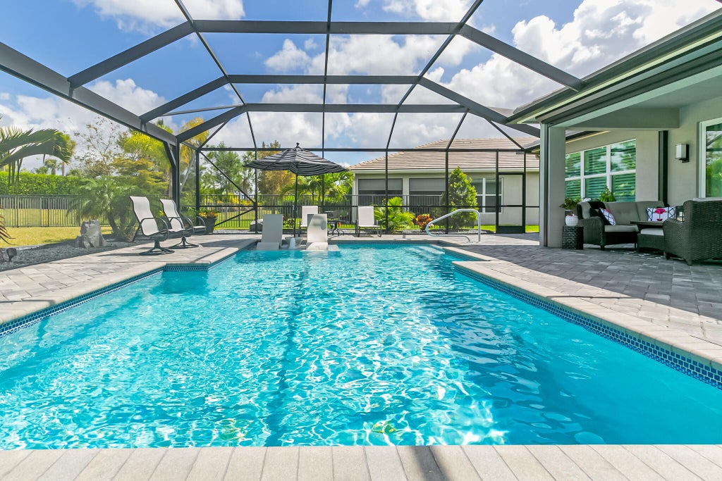 Photo of 11409 SW Half Moon Lake Lane, Port Saint Lucie, FL 34987 (MLS # R11078967)