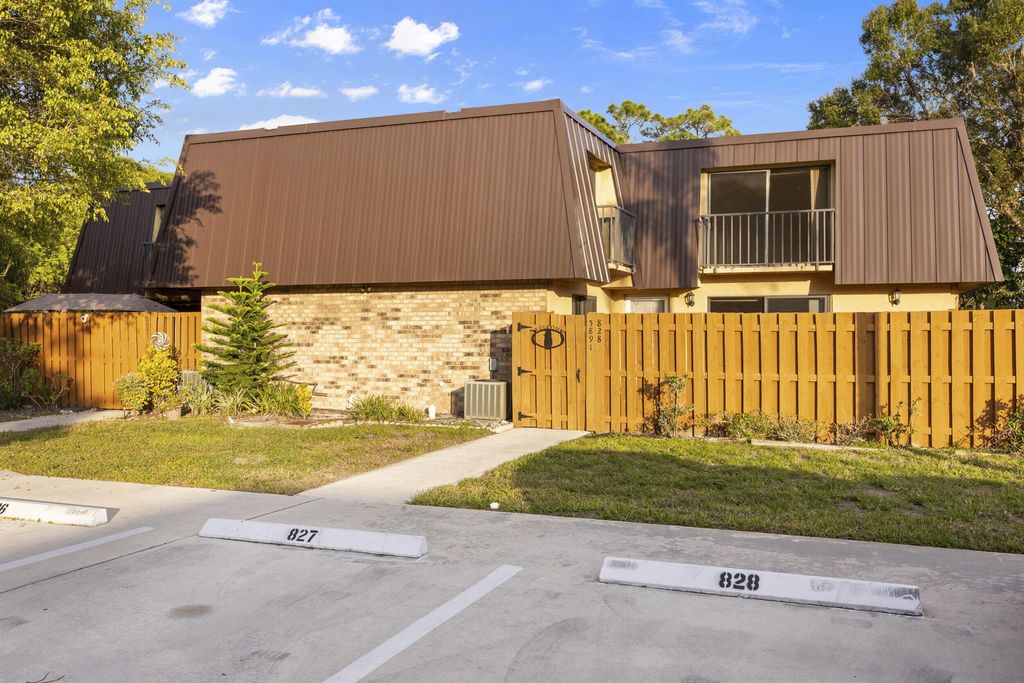 Photo of 5891 SE Windsong Lane #828, Stuart, FL 34997 (MLS # R11047017)