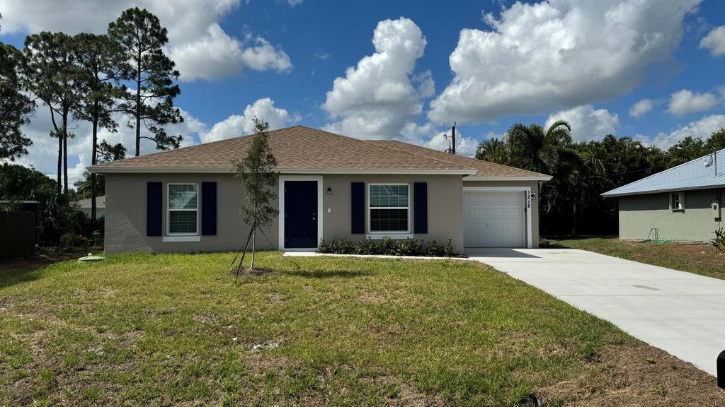 Photo of 1218 SW Asturia Avenue, Port Saint Lucie, FL 34953 (MLS # R10993284)