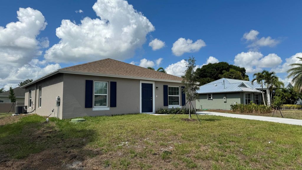 Photo of 1218 SW Asturia Avenue, Port Saint Lucie, FL 34953 (MLS # R10993284)