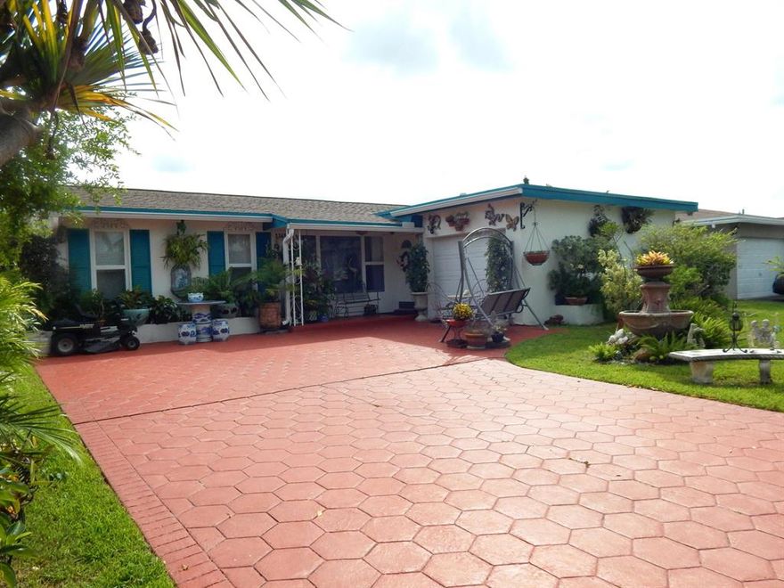 IMPACT GLASS throughout home, tremendous value, hurricane ready! CBS construction, newer roof.  Private, fenced in tropical backyard with separate dog run on side of home.  Covered patio is perfect for relaxing all winter long and enjoying the Florida weather.  Storage shed in backyard.  Hardwired alarm system with multiple cameras.  Tile floors and updated bathrooms.  Garage has very nice tile floors and A/C, can be used as living space or a very nice garage.   Just minutes from the Sawgrass Mills Shopping Complex with numerous shops and restaurants, the BB and T center which holds some of the biggest events in South Florida, you are only minutes from the Sawgrass Expressway.   Enjoy being west where it's quiet and less congestion but still not far from Fort Lauderdale and the beach.