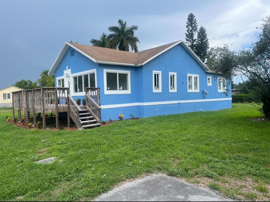 Photo of 242 NW 3rd Avenue, South Bay, FL 33493 (MLS # R11000544)