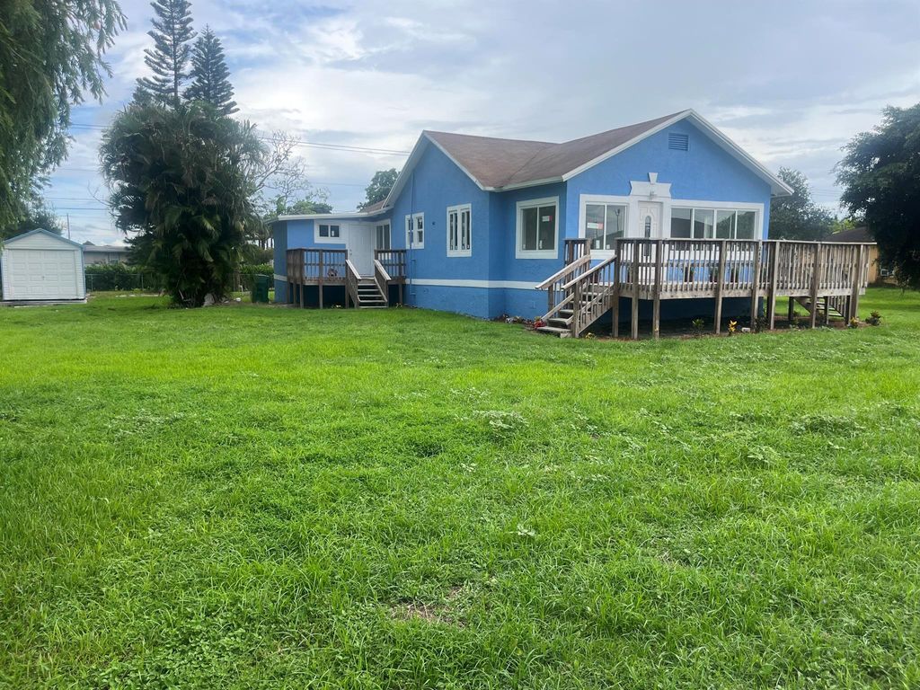 Photo of 242 NW 3rd Avenue, South Bay, FL 33493 (MLS # R11000544)